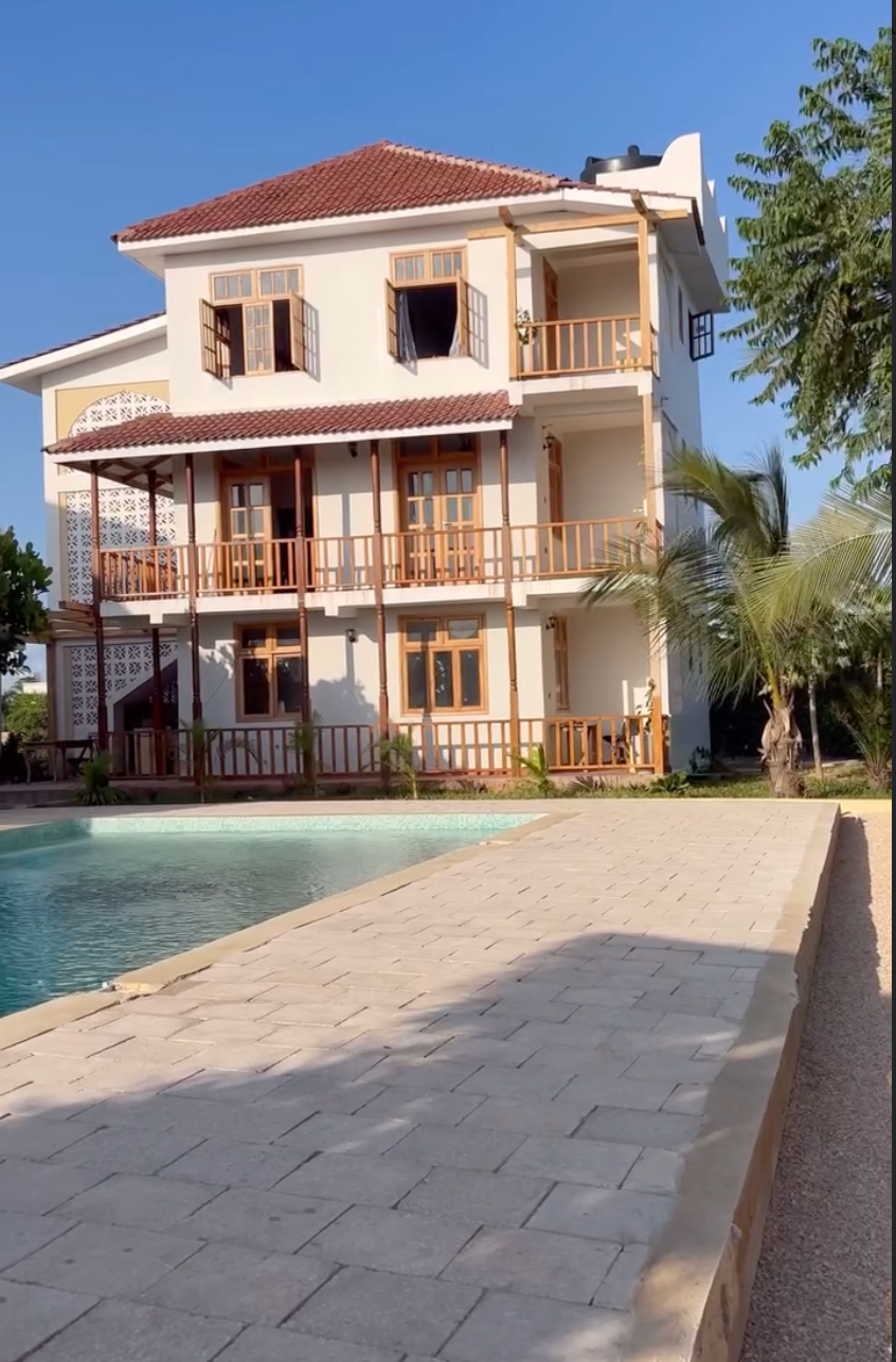 South East Coast House in Bwejuu, Zanzibar — a modern white building with pool and palm trees